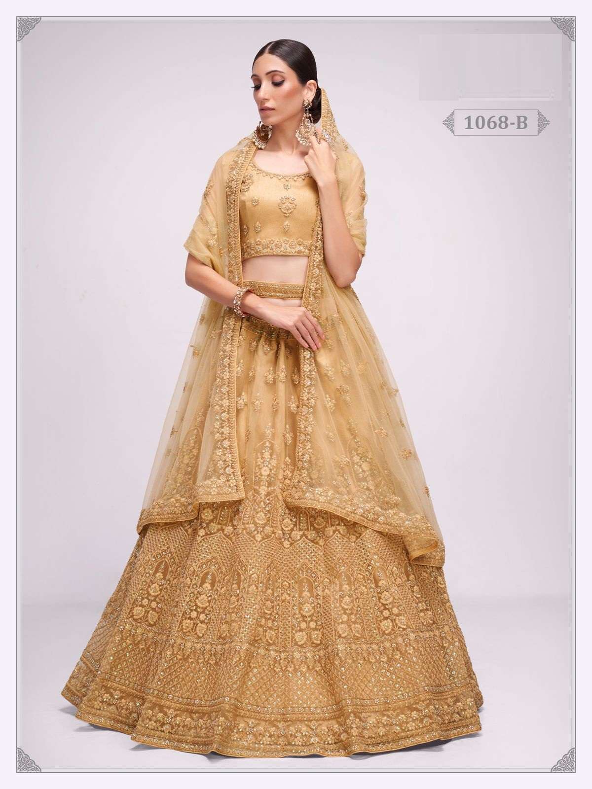 PREMIUM BRIDAL WEAR DESIGNER HEAVY CHIKU NET LEHENGA NEW DESIGN 1068B